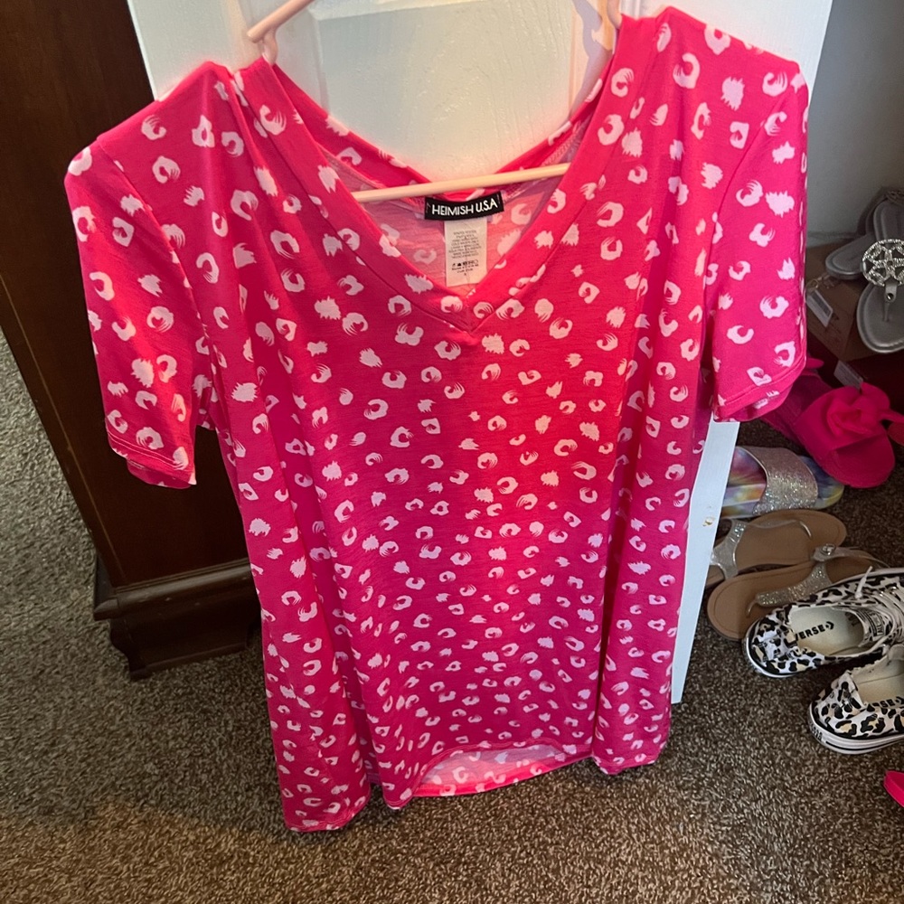 New. Hot pink top with white leopard. Size small.